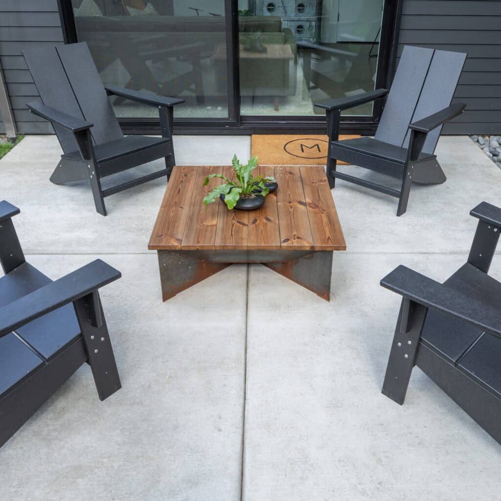 Concrete patio installed in back garden of modern Dorset home
