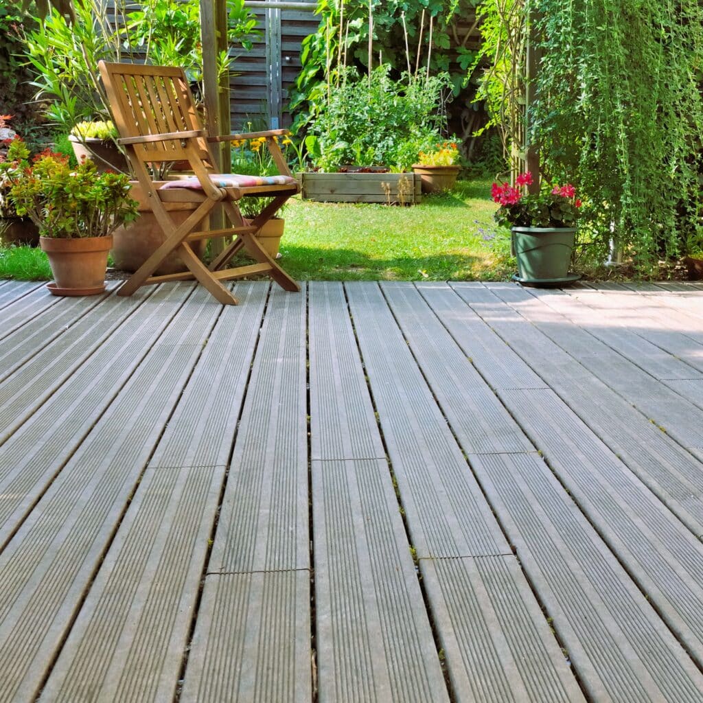 Wooden decked terrace in garden of Dorset home